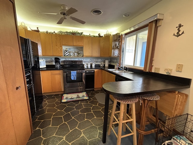 129 Chase Ave Unit 11U, Russells Point, OH 43348 - kitchen with electric stove, dark countertops, white microwave, and a sink