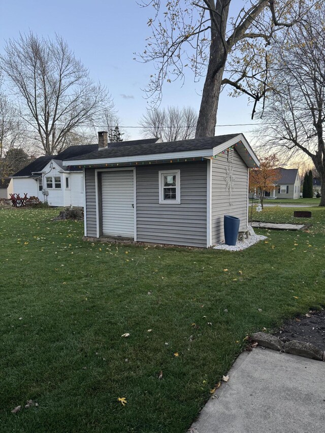 outdoor structure at dusk with a lawn