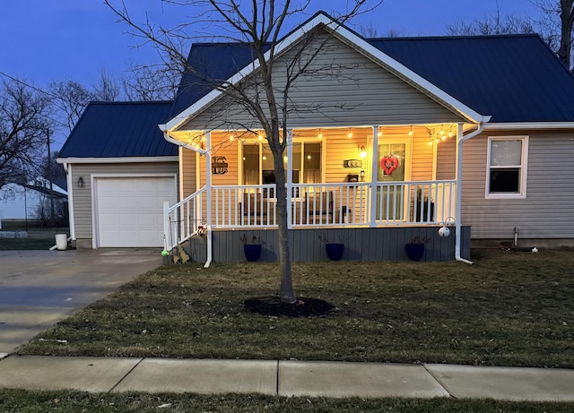 view of front of home featuring a garage and covered porch