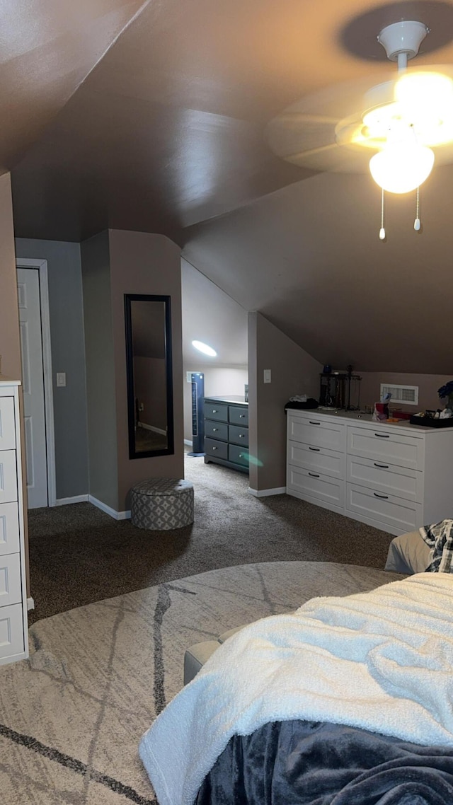 bedroom featuring lofted ceiling and carpet floors