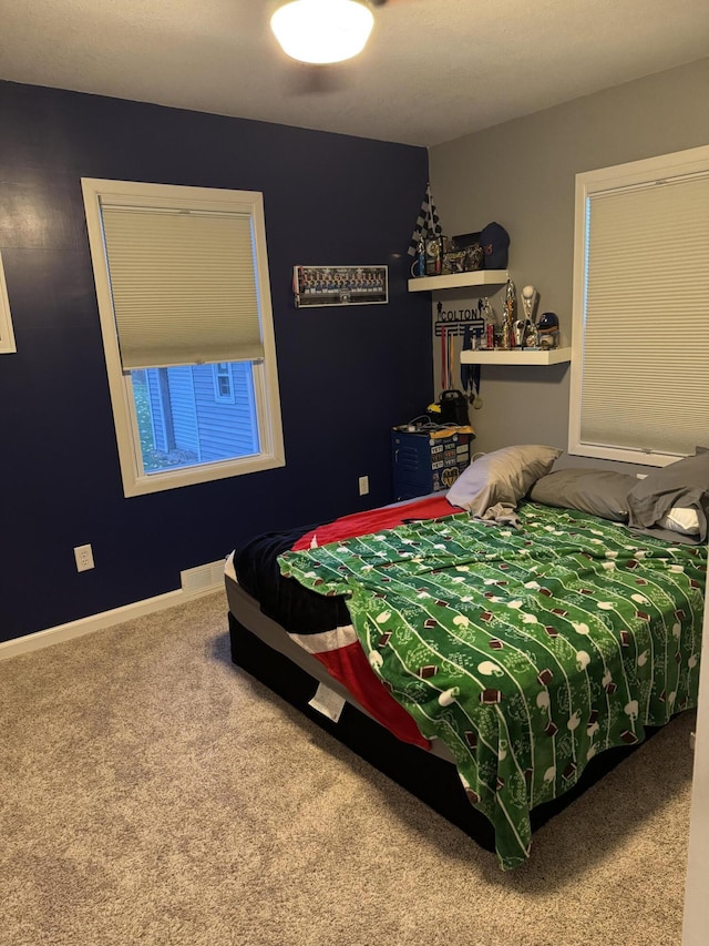 bedroom featuring carpet