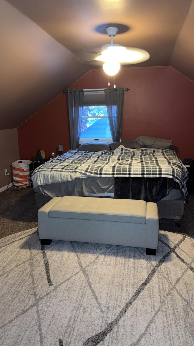 bedroom with vaulted ceiling, carpet, and ceiling fan