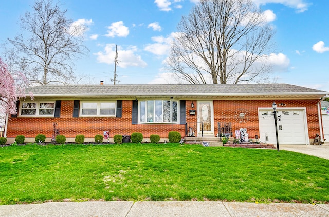 ranch-style house featuring roof with shingles, driveway, a front yard, brick siding, and a garage