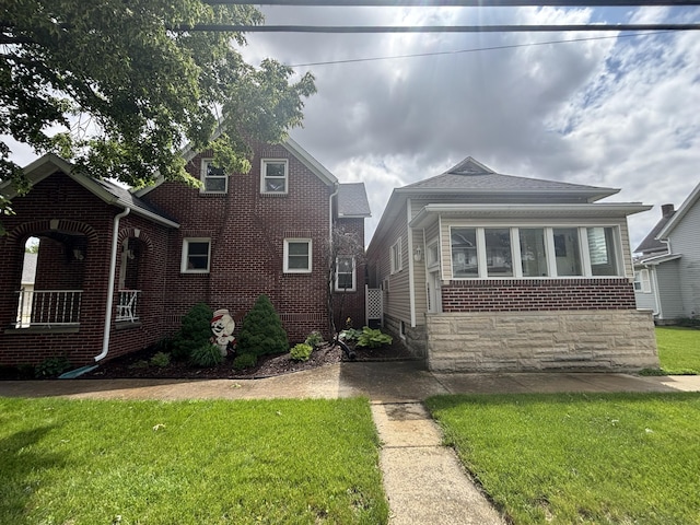 217 S 2nd St, Coldwater, OH 45828 - view of front of property with a front lawn and brick siding