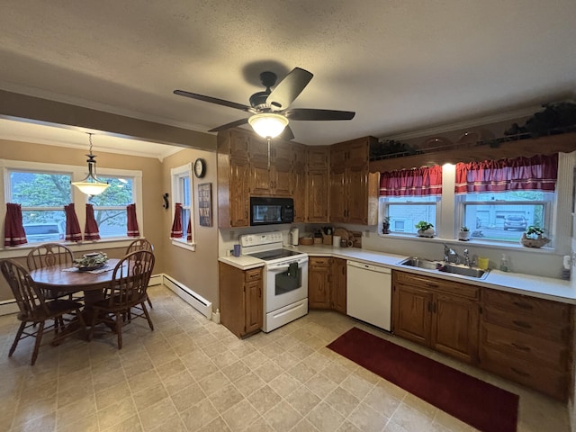 217 S 2nd St, Coldwater, OH 45828 - kitchen featuring white appliances, a sink, ornamental molding, light countertops, and baseboard heating