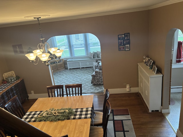 217 S 2nd St, Coldwater, OH 45828 - dining room with a chandelier, arched walkways, a baseboard radiator, crown molding, and baseboards