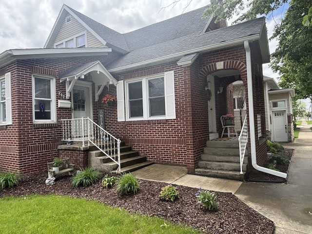 217 S 2nd St, Coldwater, OH 45828 - view of front facade with brick siding and roof with shingles