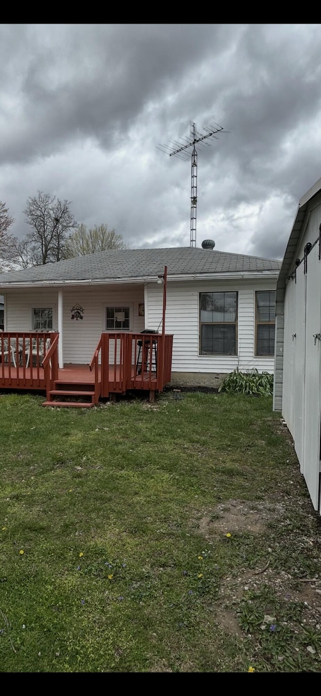 11188 Chickasaw Path, Lakeview, OH 43331 - rear view of house with a yard and a deck