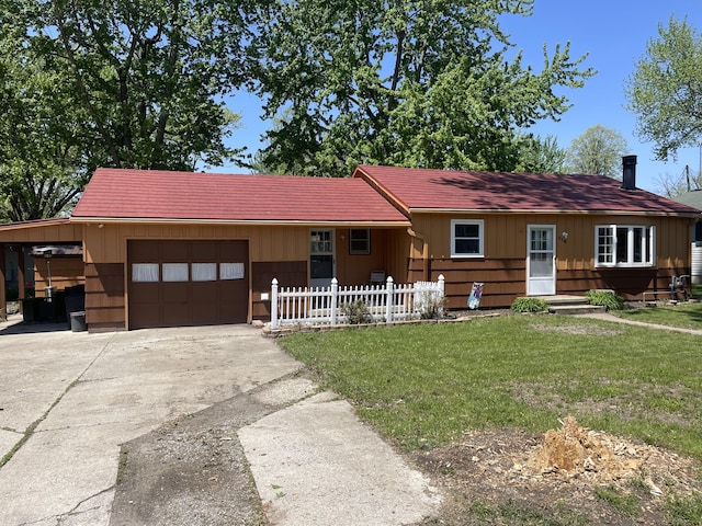 ranch-style home featuring a garage, driveway, a carport, and board and batten siding