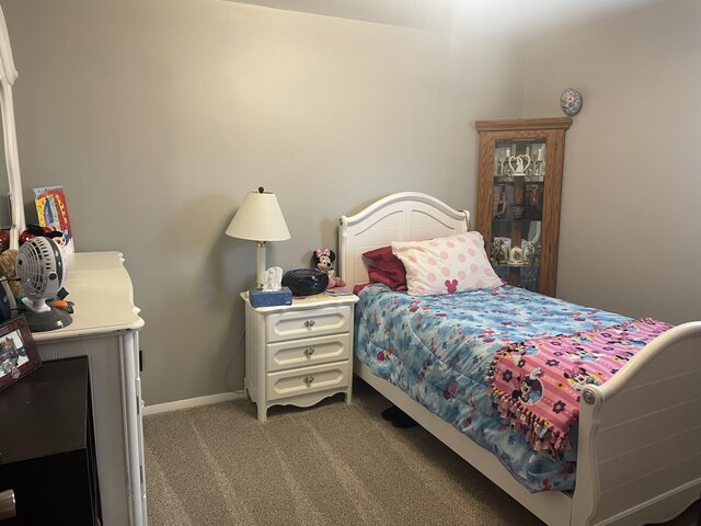 carpeted bedroom with baseboards