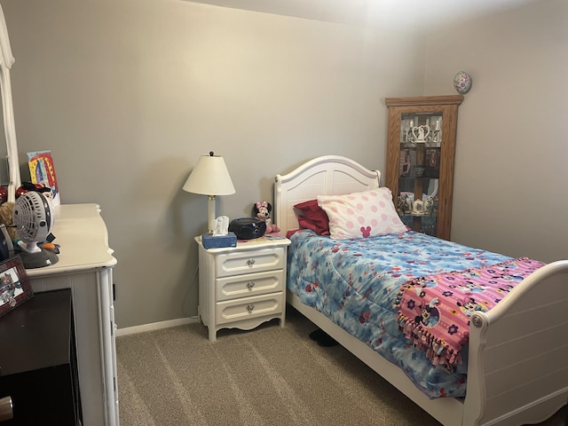 carpeted bedroom with baseboards