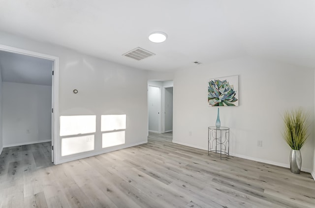 unfurnished room with light wood-type flooring