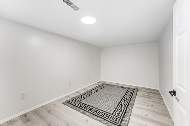 unfurnished room with light wood-type flooring