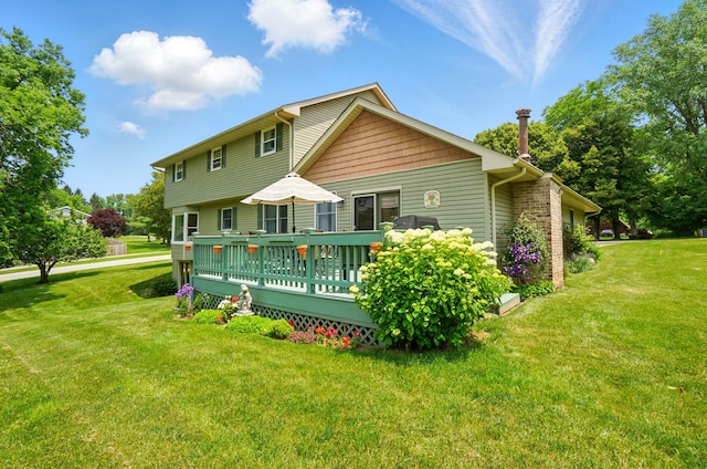 115 Deer Run Rd, Urbana, OH 43078 - rear view of property featuring a deck and a yard