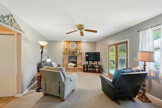 115 Deer Run Rd, Urbana, OH 43078 - carpeted living area with a fireplace and a ceiling fan