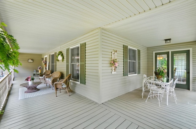 115 Deer Run Rd, Urbana, OH 43078 - wooden porch featuring outdoor dining space