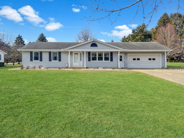 ranch-style home featuring a front lawn, an attached garage, driveway, and a chimney