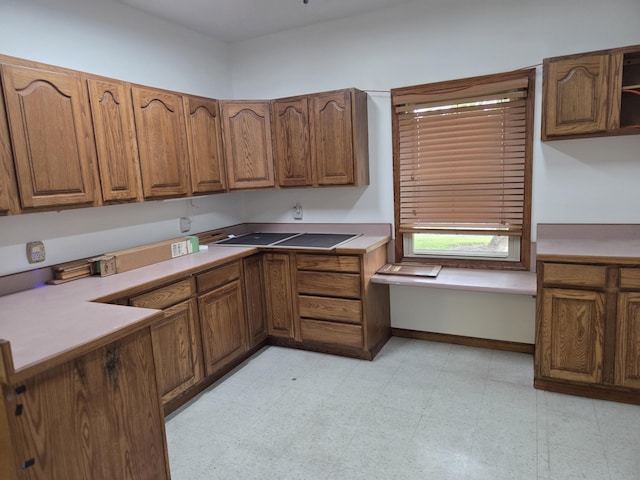 6708 Hillside Ct, Celina, OH 45822 - kitchen with brown cabinetry, open shelves, baseboards, light countertops, and light flooring