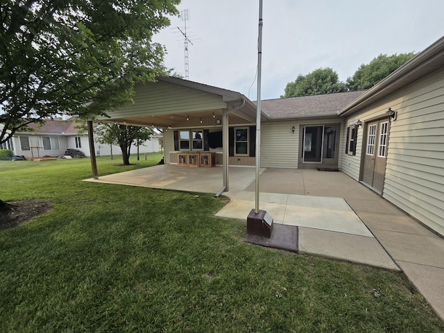 6708 Hillside Ct, Celina, OH 45822 - rear view of property featuring a yard, a patio area, and roof with shingles