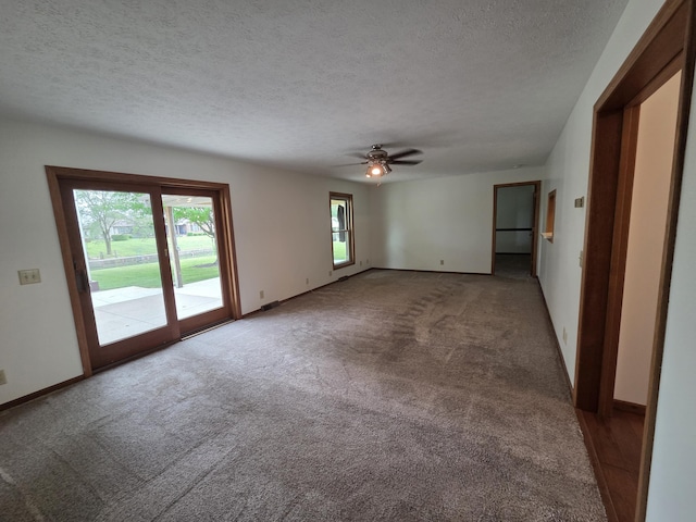 6708 Hillside Ct, Celina, OH 45822 - spare room with a textured ceiling, carpet flooring, a ceiling fan, and baseboards