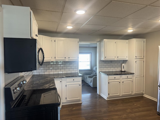 5319 Karafit Rd, Celina, OH 45822 - kitchen with stainless steel electric range oven, white cabinetry, a paneled ceiling, dark wood-style floors, and backsplash