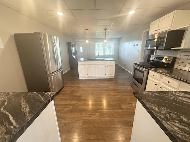 5319 Karafit Rd, Celina, OH 45822 - kitchen with appliances with stainless steel finishes, dark wood-style flooring, white cabinets, pendant lighting, and recessed lighting