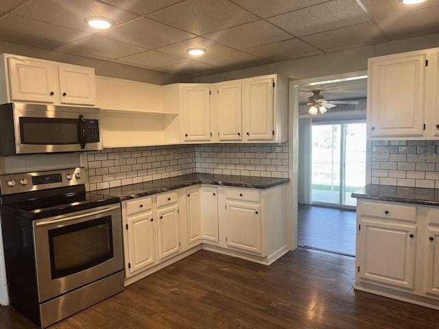 5319 Karafit Rd, Celina, OH 45822 - kitchen featuring stainless steel appliances, white cabinets, ceiling fan, decorative backsplash, and a drop ceiling