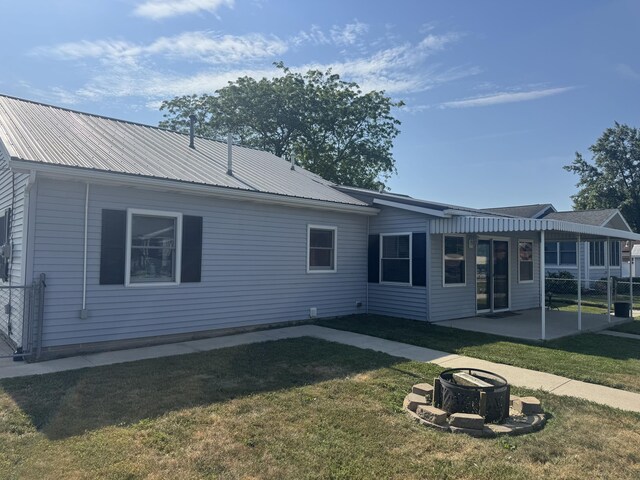 5319 Karafit Rd, Celina, OH 45822 - rear view of house with an outdoor fire pit, a patio area, and a metal roof