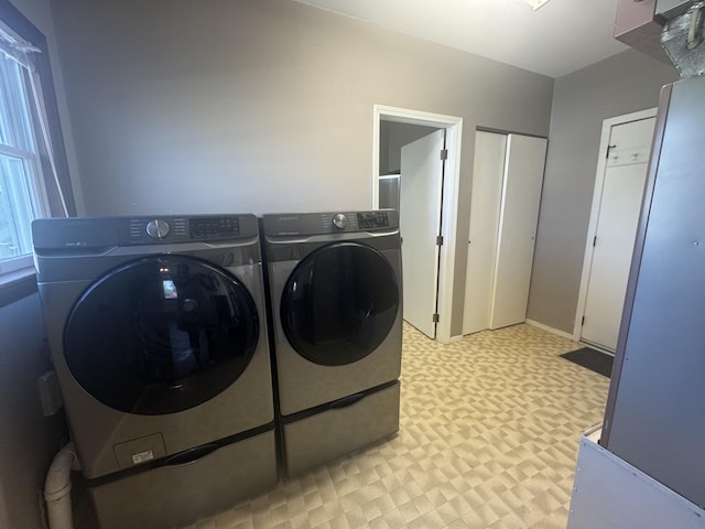 5319 Karafit Rd, Celina, OH 45822 - washroom with light flooring and washing machine and dryer