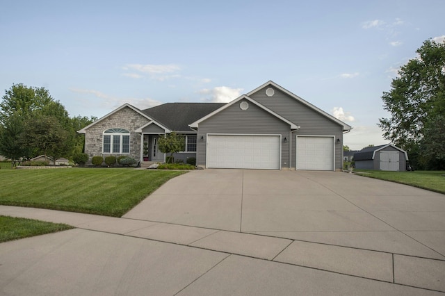 view of front of house featuring a garage and a front yard