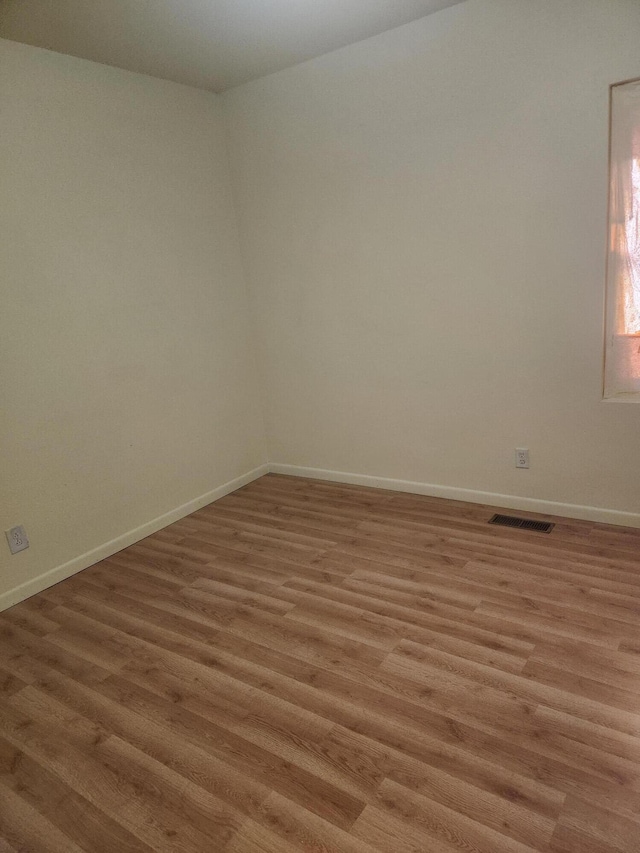 411-413 Water St, Connersville, IN 47331 - spare room featuring light wood-style flooring and baseboards