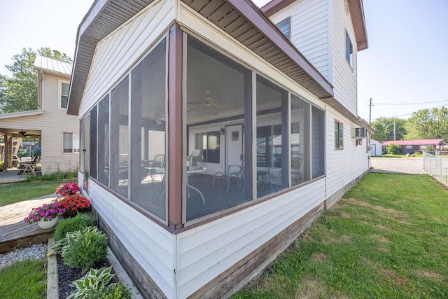 7535 Township Rd 269, Russells Point, OH 43348 - view of home's exterior with a sunroom, ceiling fan, and a lawn