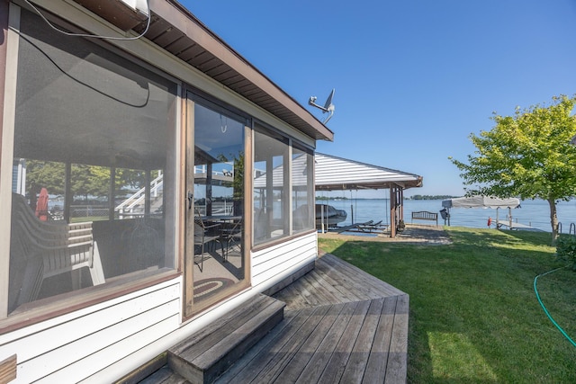 7535 Township Rd 269, Russells Point, OH 43348 - deck featuring boat lift, a water view, a sunroom, a yard, and a boat dock