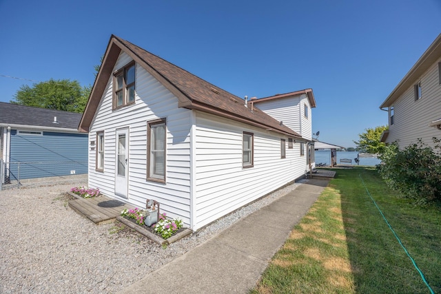 7535 Township Rd 269, Russells Point, OH 43348 - view of side of home featuring a yard and a shingled roof
