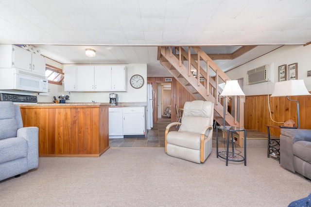 7535 Township Rd 269, Russells Point, OH 43348 - living area featuring carpet floors, a wall mounted AC, stairway, and wood walls