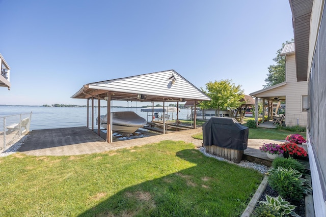 7535 Township Rd 269, Russells Point, OH 43348 - dock featuring boat lift, a yard, and a water view