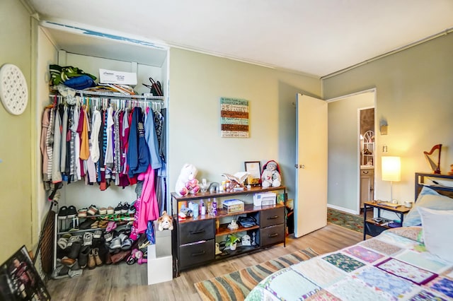 bedroom featuring a closet and wood finished floors