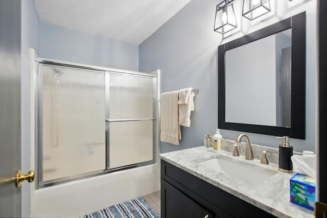 1264 Pheasant Run Unit 74, Springfield, OH 45503 - full bathroom with vanity, combined bath / shower with glass door, and wood finished floors