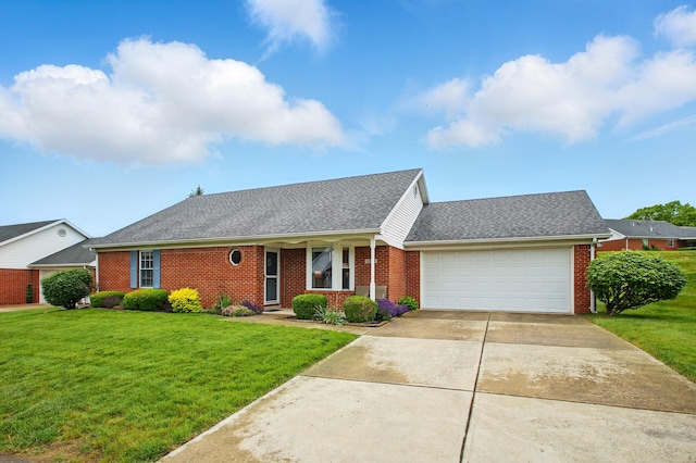 1264 Pheasant Run Unit 74, Springfield, OH 45503 - view of front of home featuring brick siding, an attached garage, driveway, and a front lawn