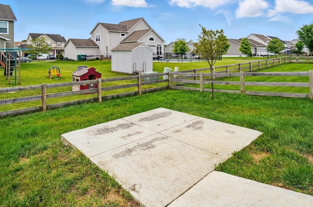 1087 Ayrshire Dr, Columbus, OH 43207 - view of yard with a residential view and a storage unit
