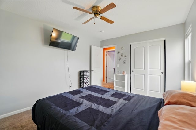 1087 Ayrshire Dr, Columbus, OH 43207 - bedroom with light colored carpet, baseboards, a closet, and ceiling fan