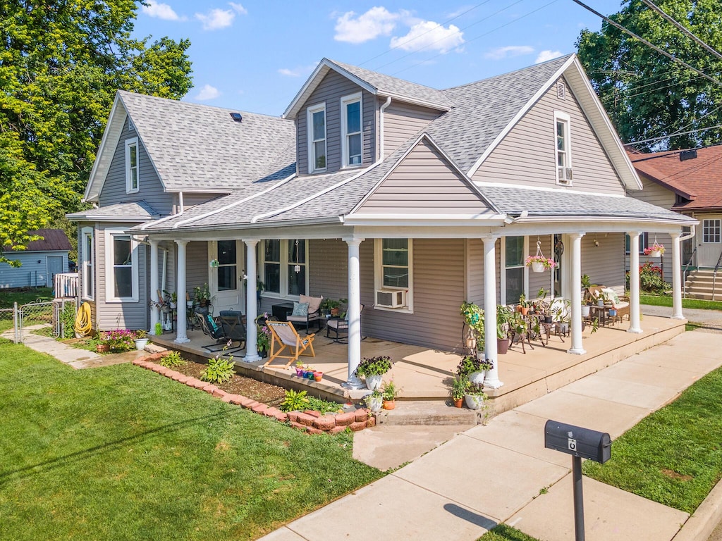 6 Church St, Pleasant Hill, OH 45359 - farmhouse inspired home featuring a shingled roof, a porch, and cooling unit