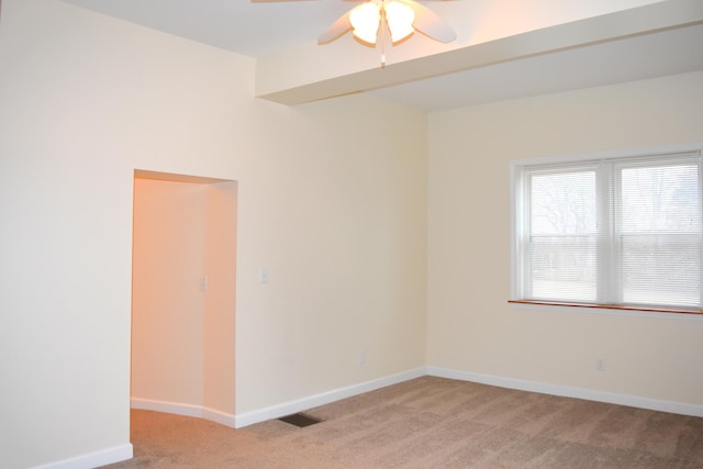 unfurnished room featuring ceiling fan and light carpet