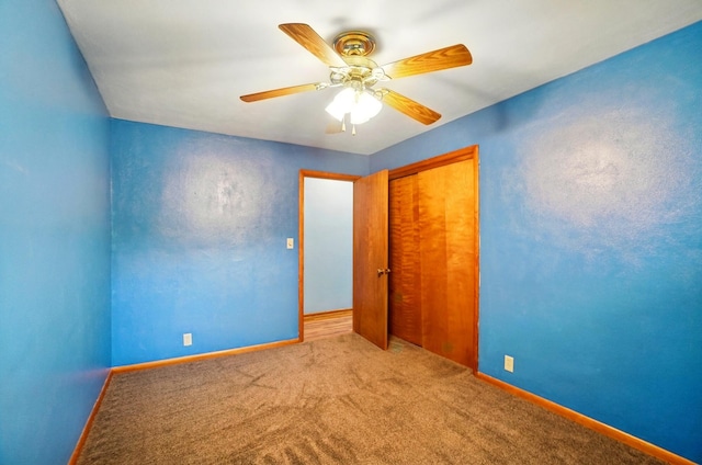 70 Helen St, Enon, OH 45323 - unfurnished bedroom with carpet floors, a closet, baseboards, and a ceiling fan