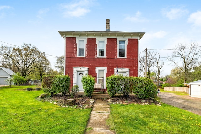 italianate house with a front yard and fence