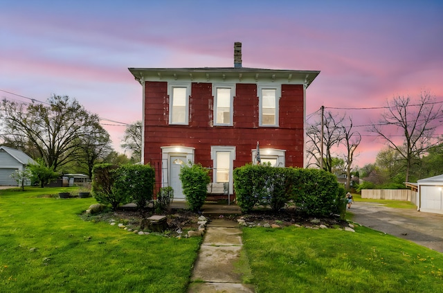 italianate house with fence and a front lawn