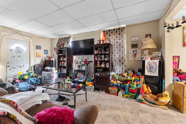 rec room featuring carpet flooring and a paneled ceiling