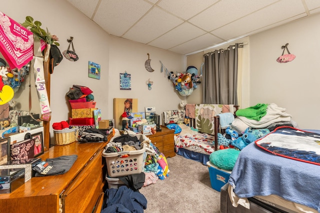 bedroom with carpet and a drop ceiling