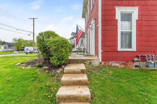 view of property exterior featuring a yard and crawl space