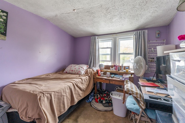 bedroom featuring a textured ceiling, carpet, and vaulted ceiling